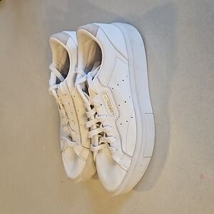 Adidas sleek white platform sneakers